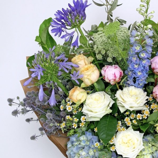 Close-up of a luxe Little Flowers bouquet featuring seasonal blooms.