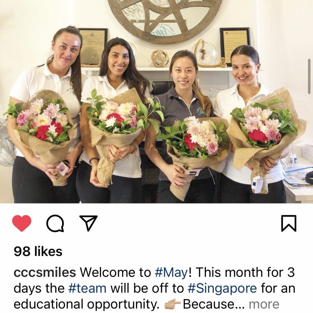 Office team celebrating a project milestone with bouquets in Sydney