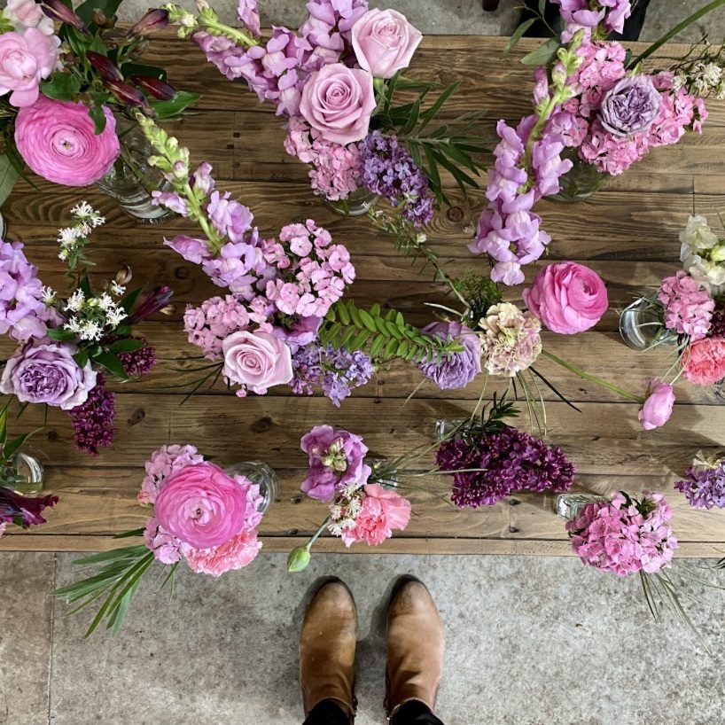 Cluster of small flower vases styled for an event