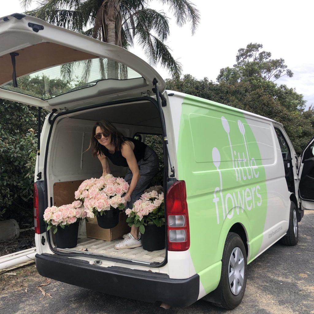 Florist loading Australian-grown flowers for Sydney flower delivery